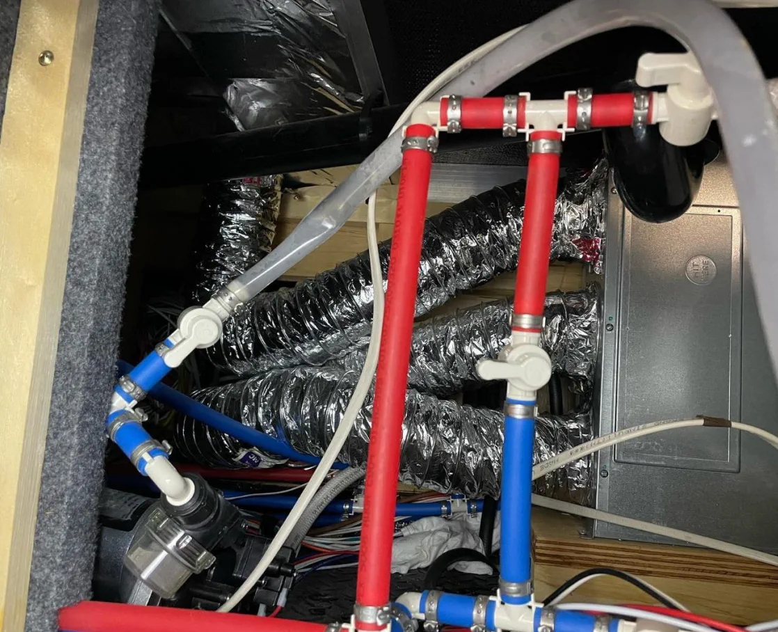Freeze-burst PEX water-line split inside an RV cabinet after an Idaho hard freeze above 4,500 ft